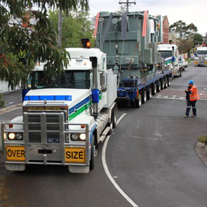 truck carrying a large transformer